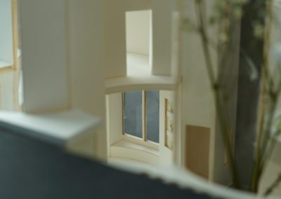 Interior photo of architecture model looking through to the front entrance