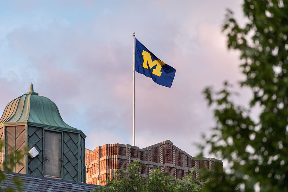 The maize Block M waves at the top of Michigan Union.