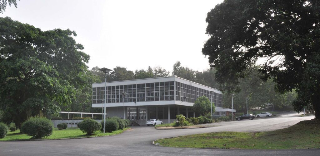 A building on the KNUST campus surrounded by trees.