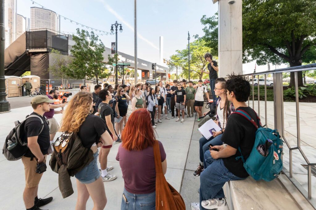 A group of students learning in a city