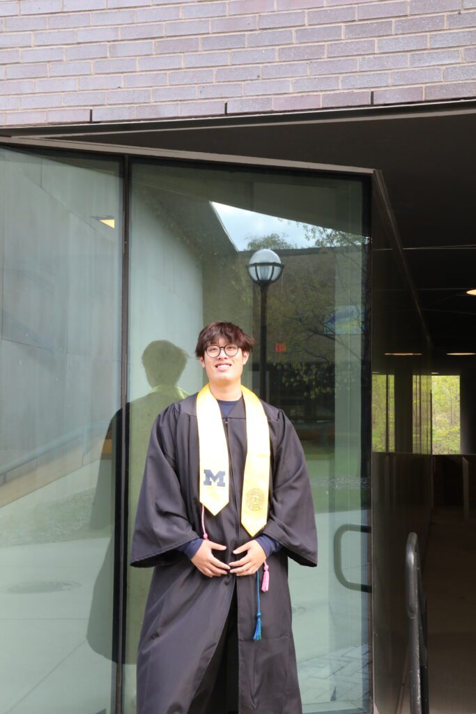 Rongyu Shen portrait photo outside of a glass window