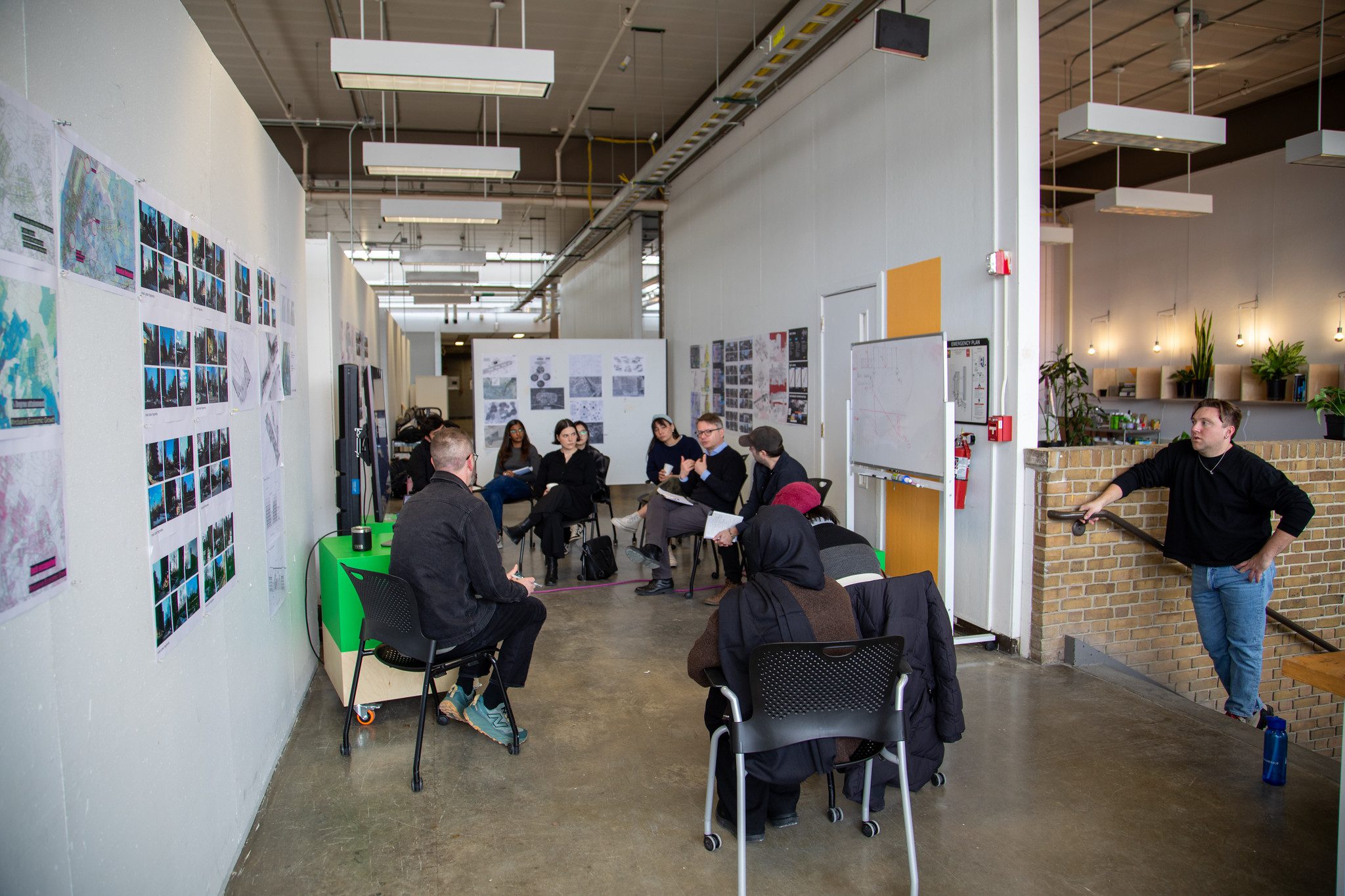 Master of Urban Design students present their work in a hallway